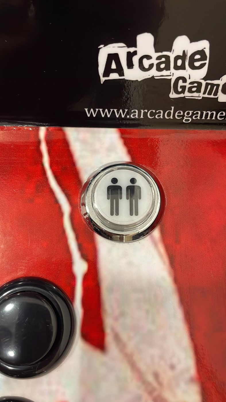 Botão de dois jogadores na máquina arcade